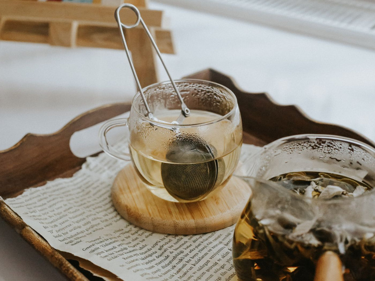 Herbal tea brewing on a wooden tray